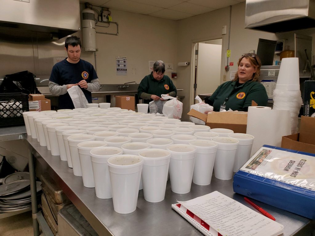 Volunteers prepare to deliver soup during coronavirus pandemic.