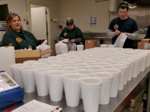Volunteers prepare to deliver soup during coronavirus pandemic.