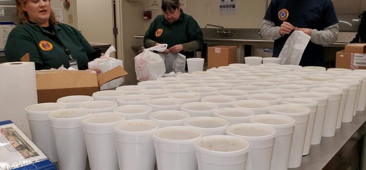 Volunteers prepare to deliver soup during coronavirus pandemic.